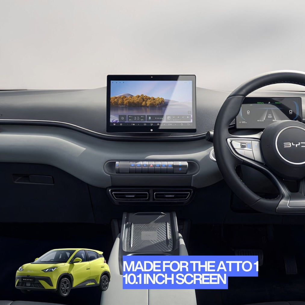 A car interior dashboard setup with a large central touchscreen display, steering wheel, and center console. A small inset of a lime green compact car appears in the lower left, and blue text at the bottom reads 'MADE FOR THE ATTO 10.
